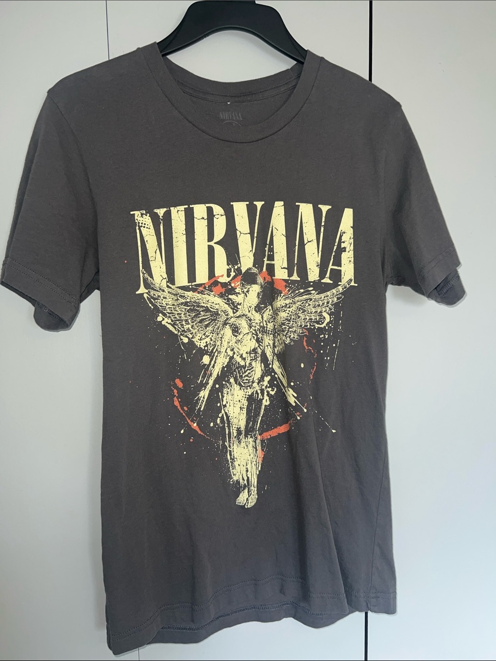 NIRVANA Black Short Sleeve Tee with Yellow Angel Graphic and Red Accents